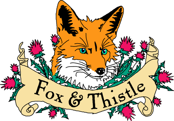Simplified Fox & Thistle Studio logo showing an orange fox among thistle flowers.