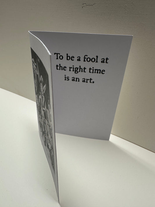 Inside view of "Fool at a Banquet" card. It reads: To be a fool at the right time is an art.