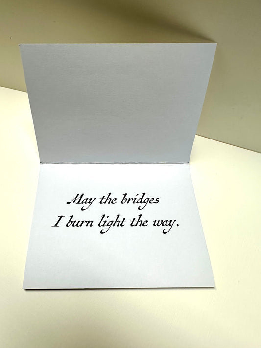 Interior of 'Crossroads Card' that reads: May the bridges I burn light the way.