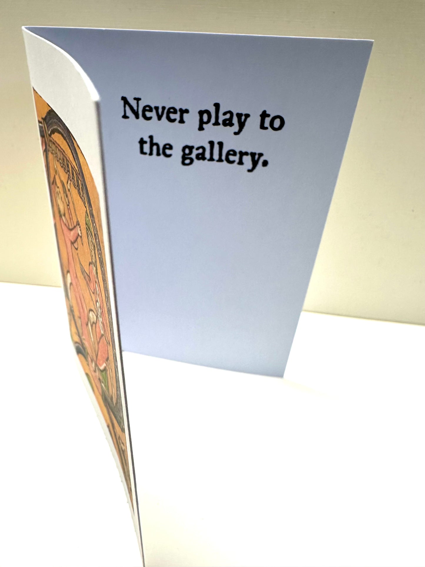 Inside of the 'Gallery Players Card' reading: Never play to the gallery.