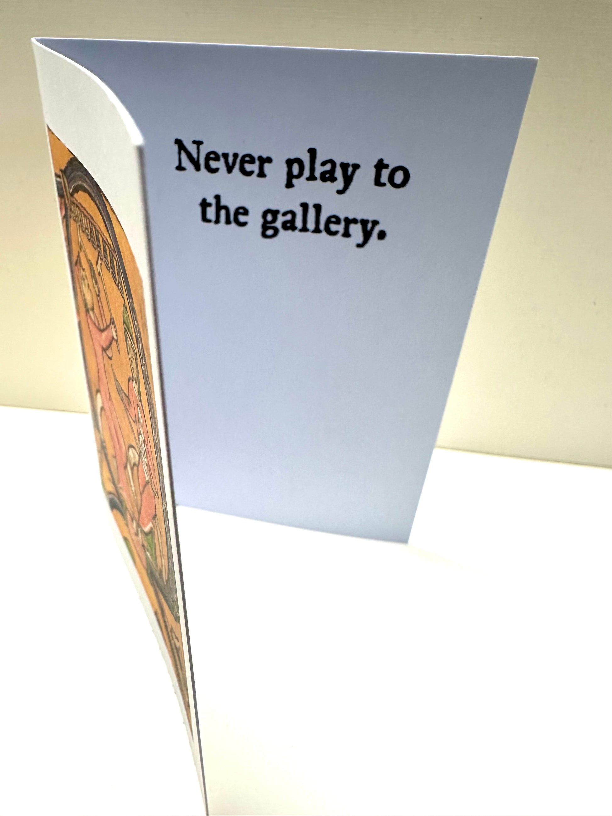 Inside of the 'Gallery Players Card' reading: Never play to the gallery.