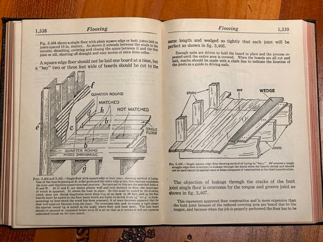 Open book on flooring with illustrations and text on a wooden surface