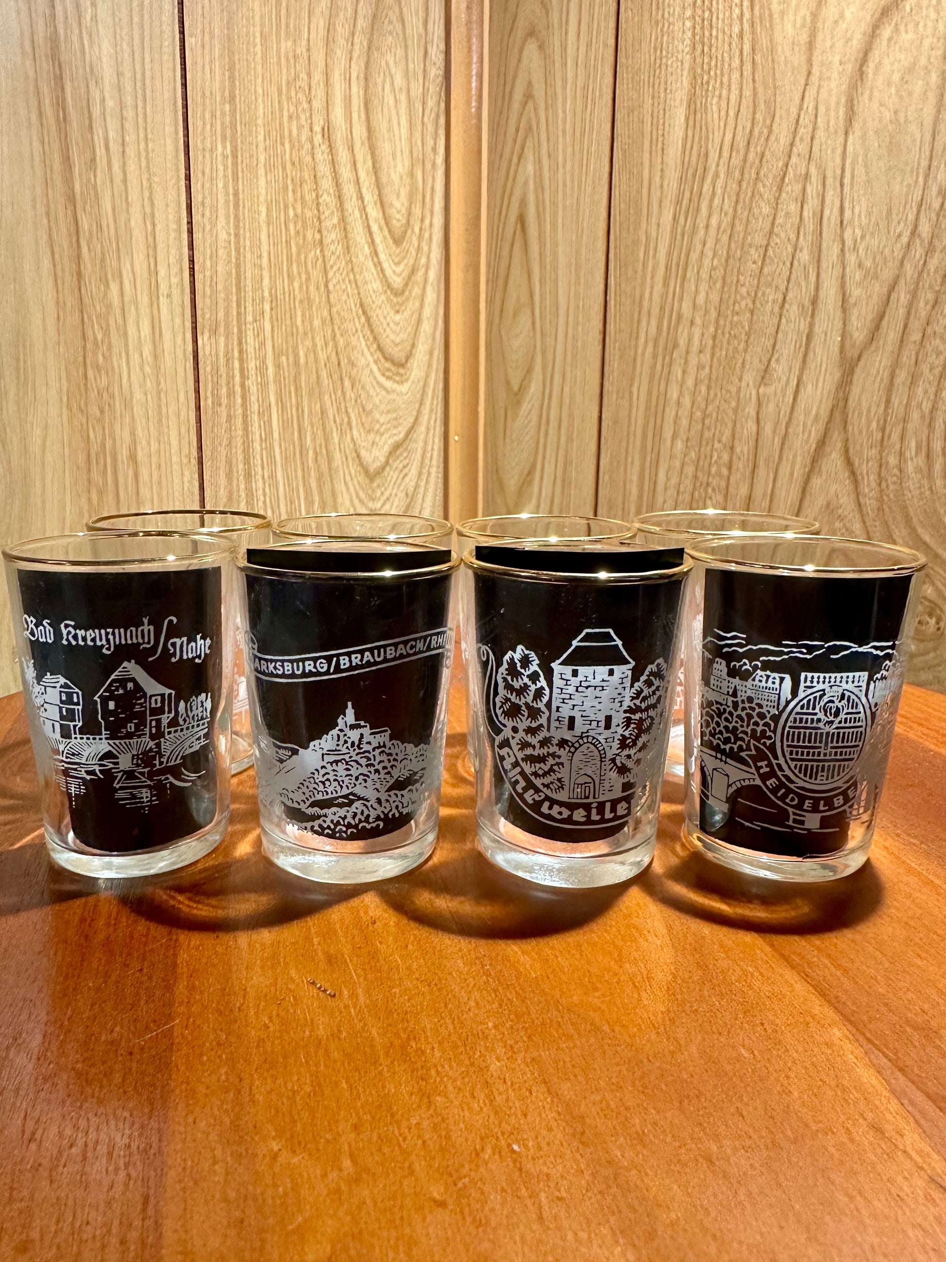 Four wine tumblers with german scenes frosted on the surfaces