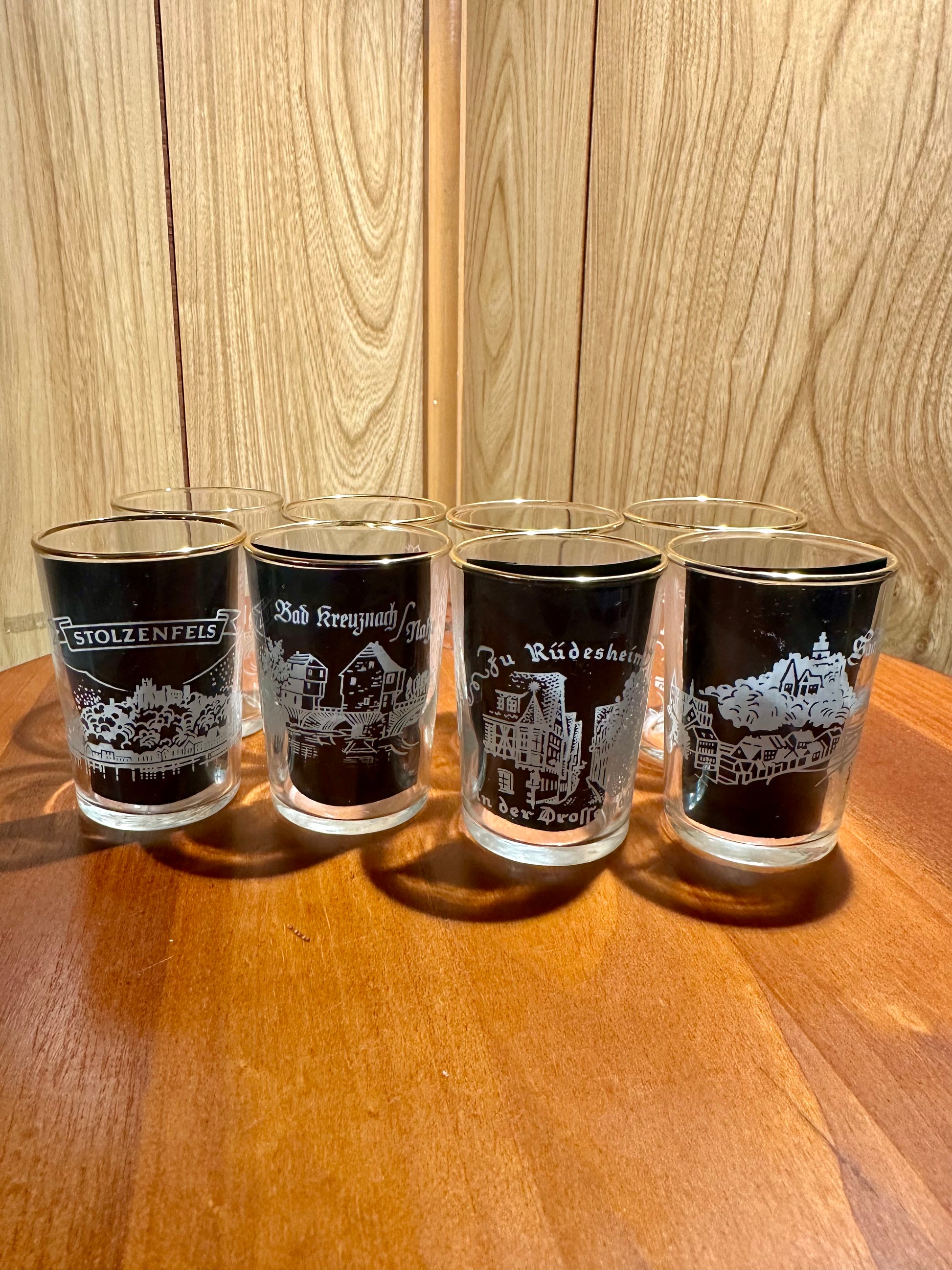 Four wine glasses with german location frosted on