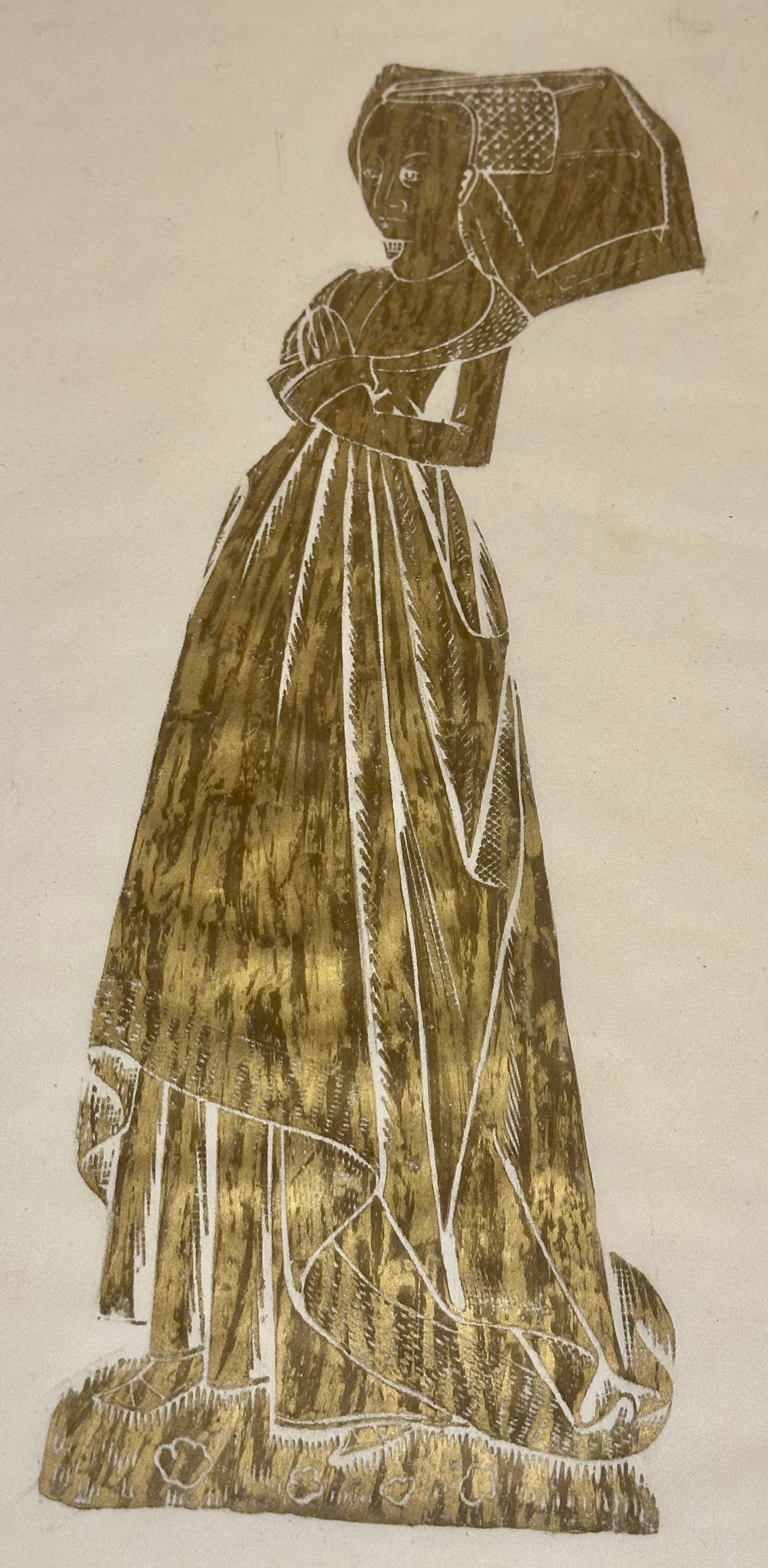 Brass rubbing of a person in a long dress and bonnet on a beige background
