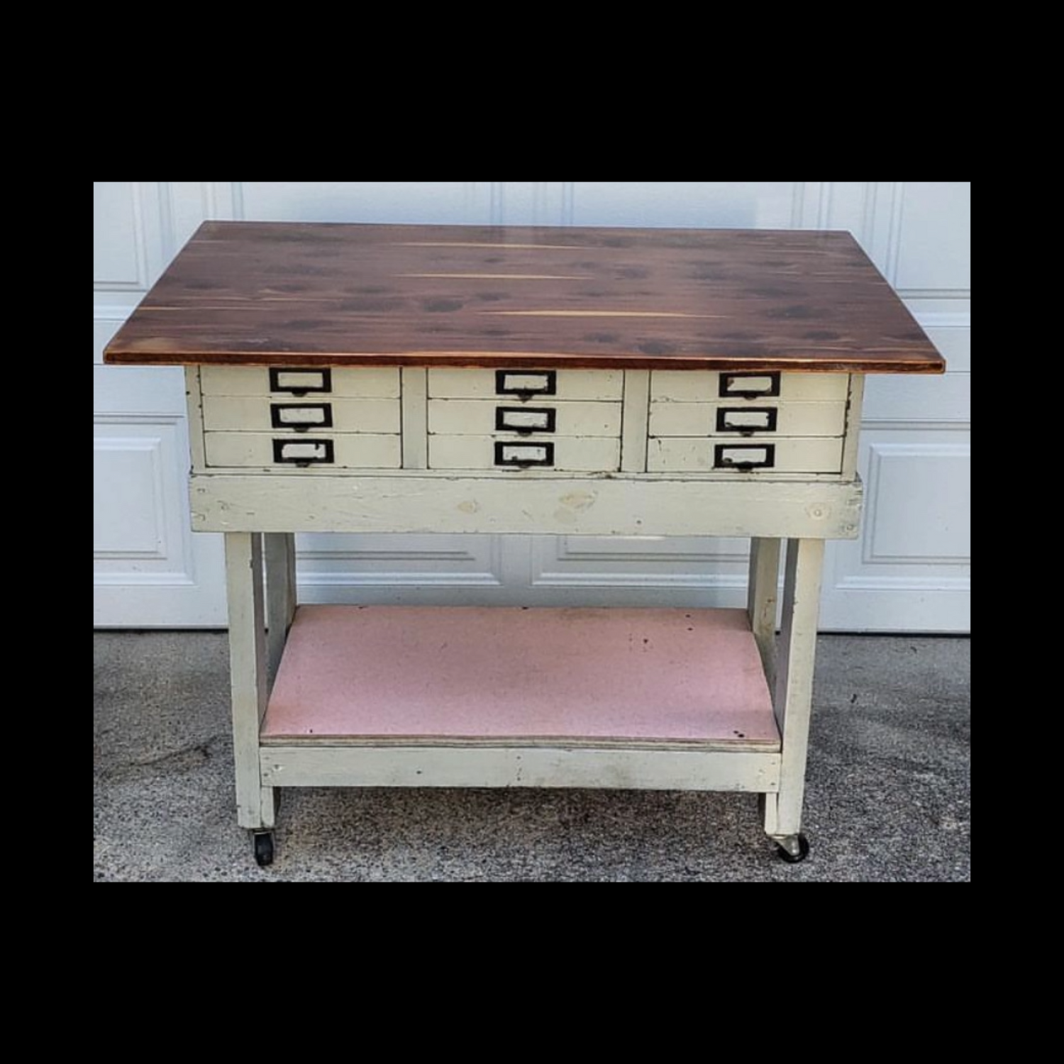 Reclaimed industrial island with 1950s metal cabinet base, pink atomic formica bottom, and reclaimed cedar top.