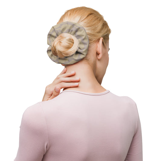 Rear view of model wearing taupe One Finger Wave scrunchie featuring minimalist line art design — soft, eco-conscious hair accessory with muted attitude.