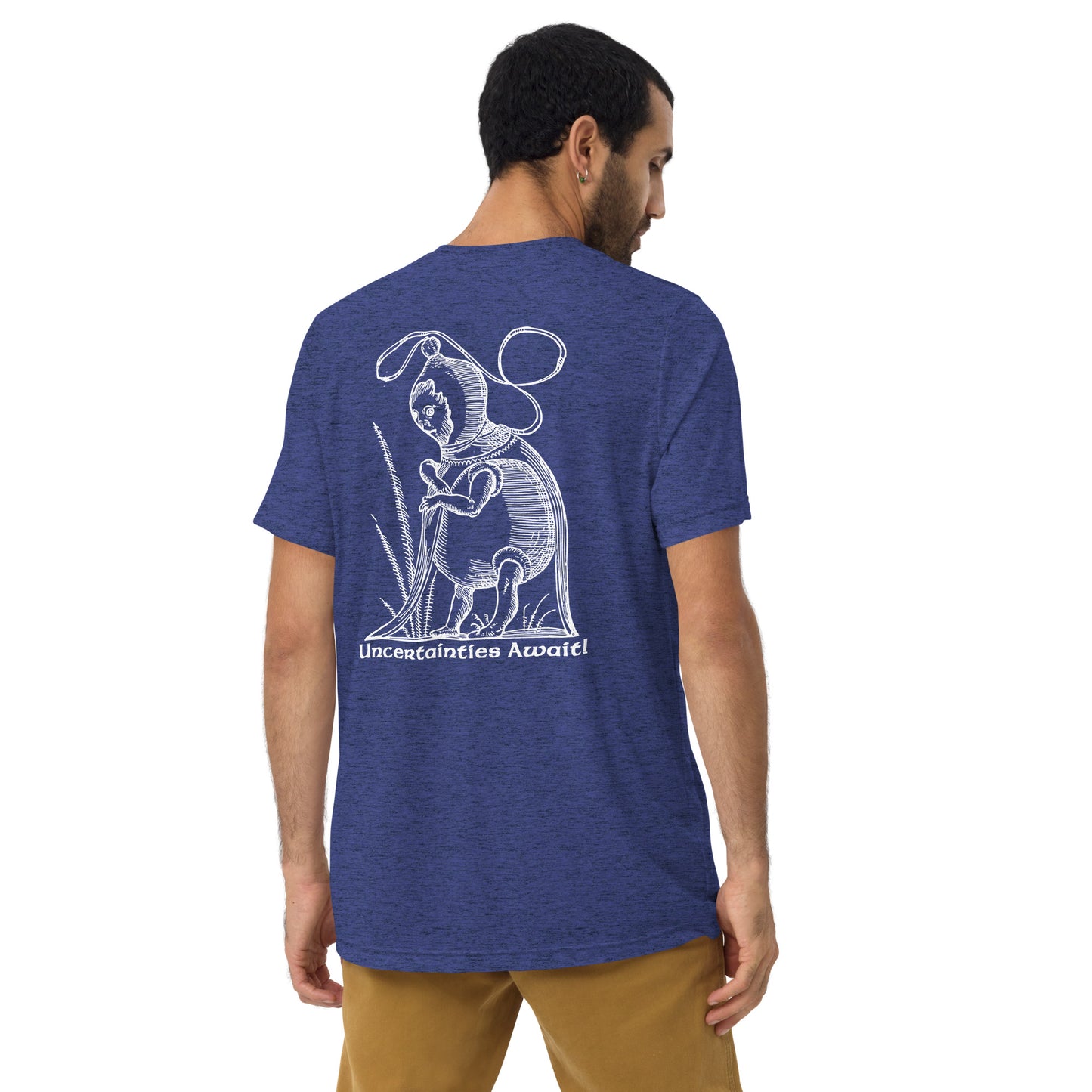 Model turned away in navy blue “Uncertainties Await” tee featuring a Renaissance-style woodcut.