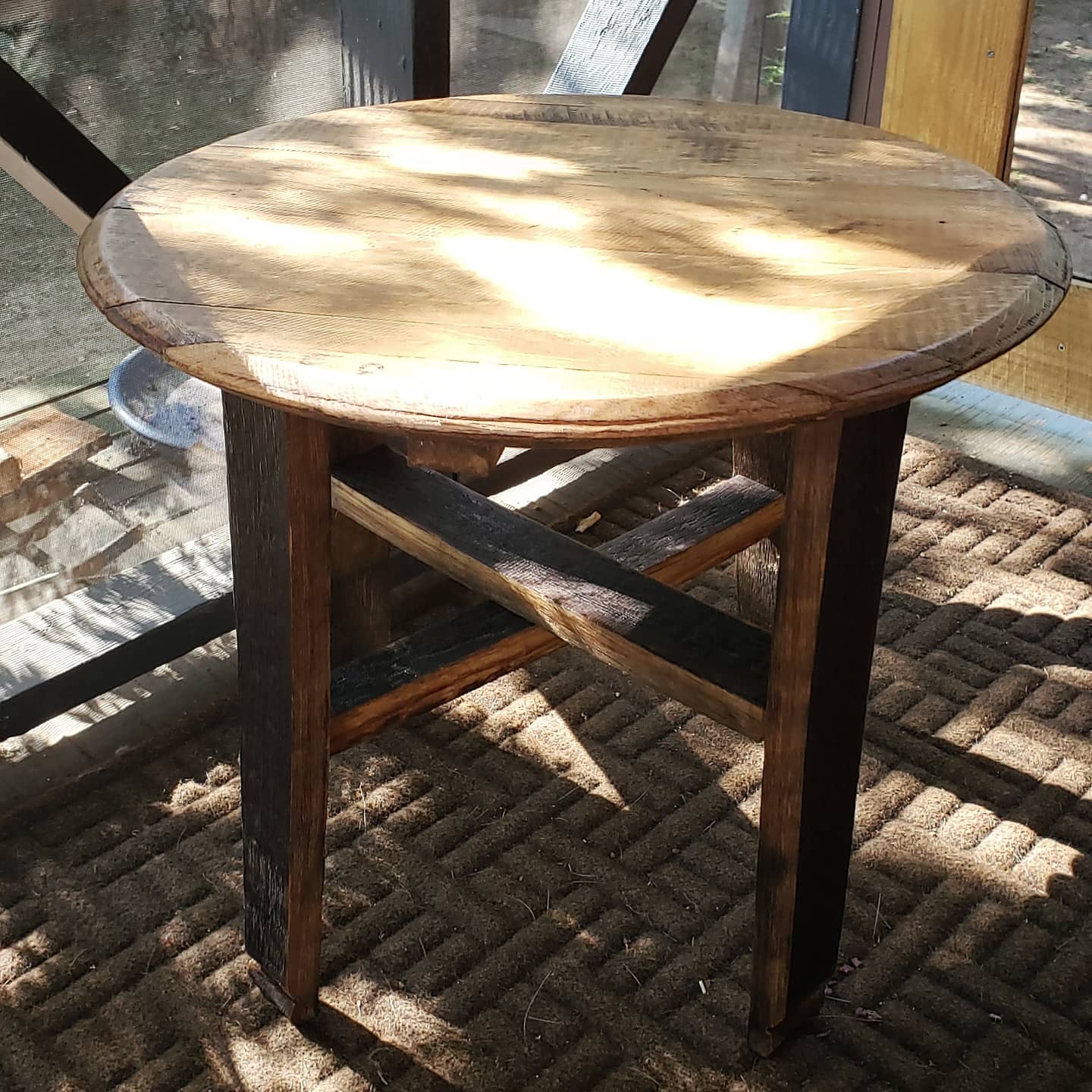 Side table made from bourbon barrel head and white oak staves. Crafted in our workshop.