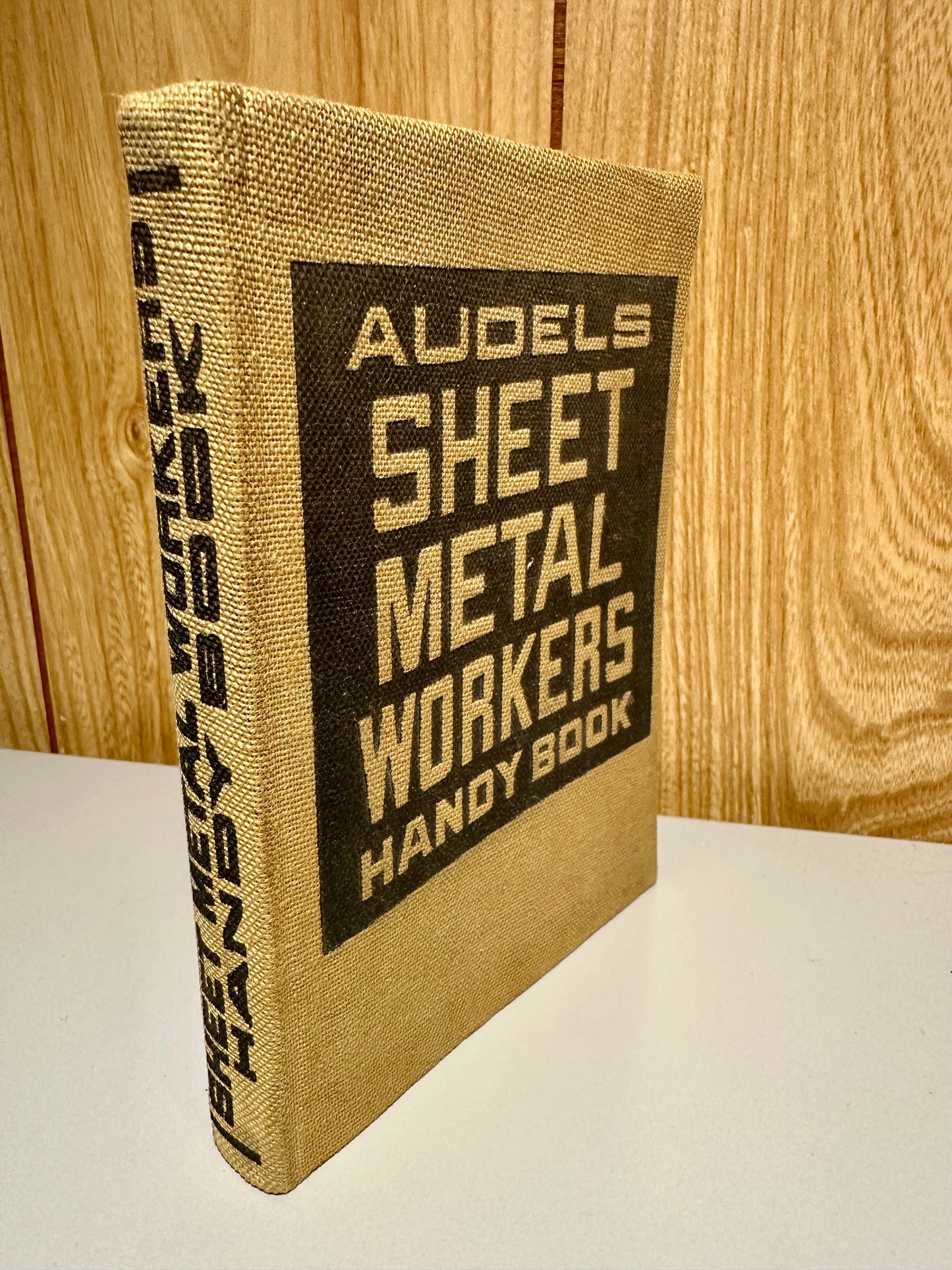 Reference sheet metal book standing on it's edge.
