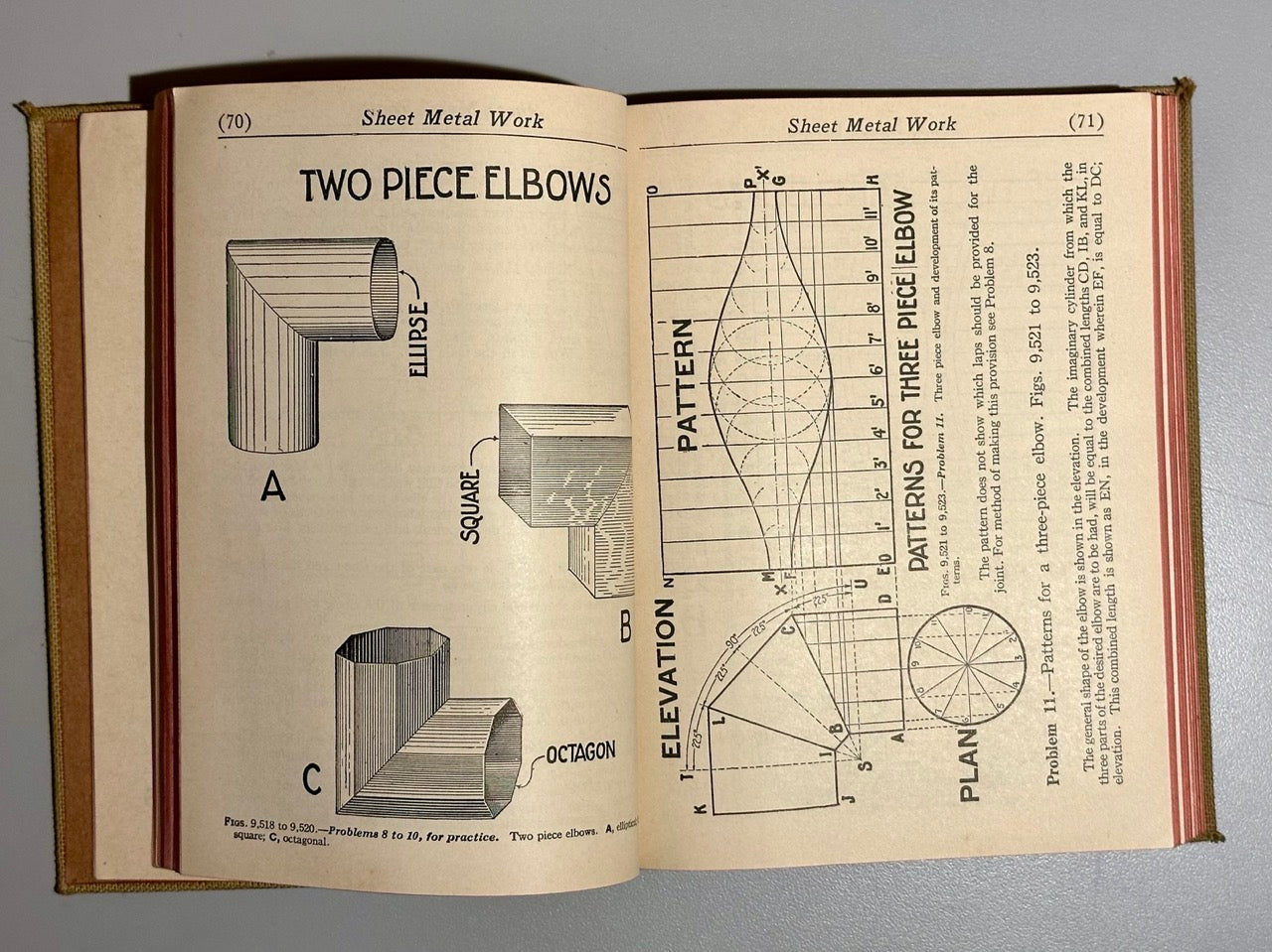 Open book showing technical drawings and diagrams of sheet metal work on a gray background