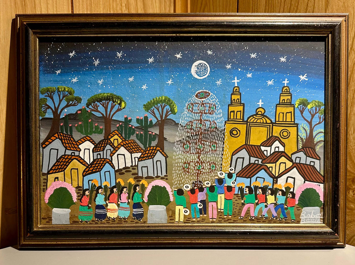 Framed artwork depicting a colorful Traditional Mexican Christmas village scene with people and buildings.