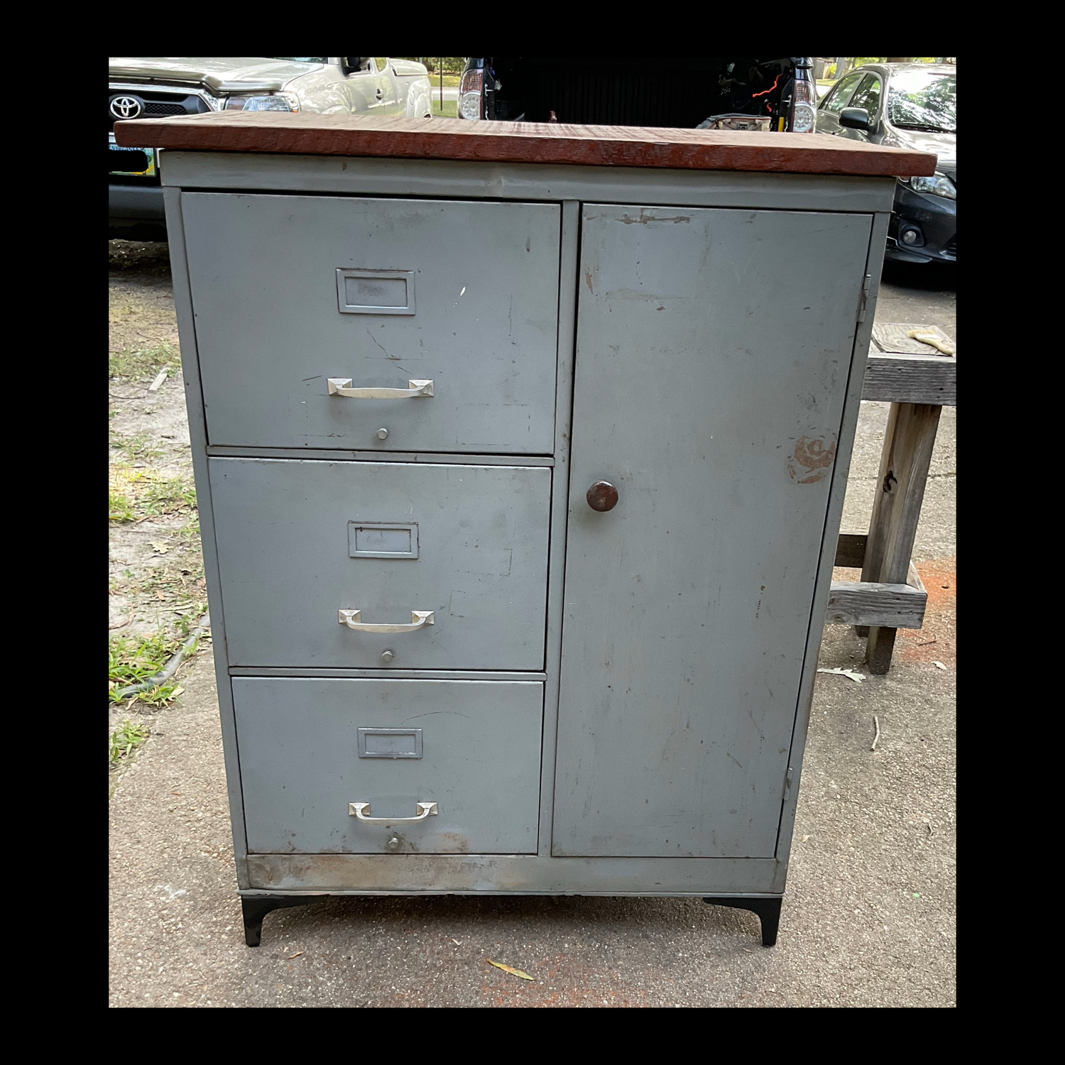 Upcycled large file cabinet and locker with metal feet and a mahogany wood top, handcrafted in our shop.