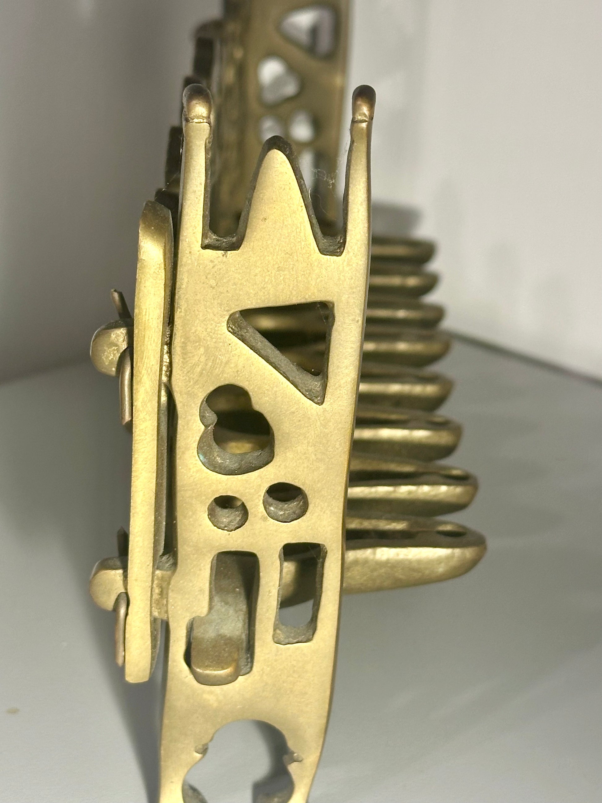 Close-up of a brass mechanical component on a white background