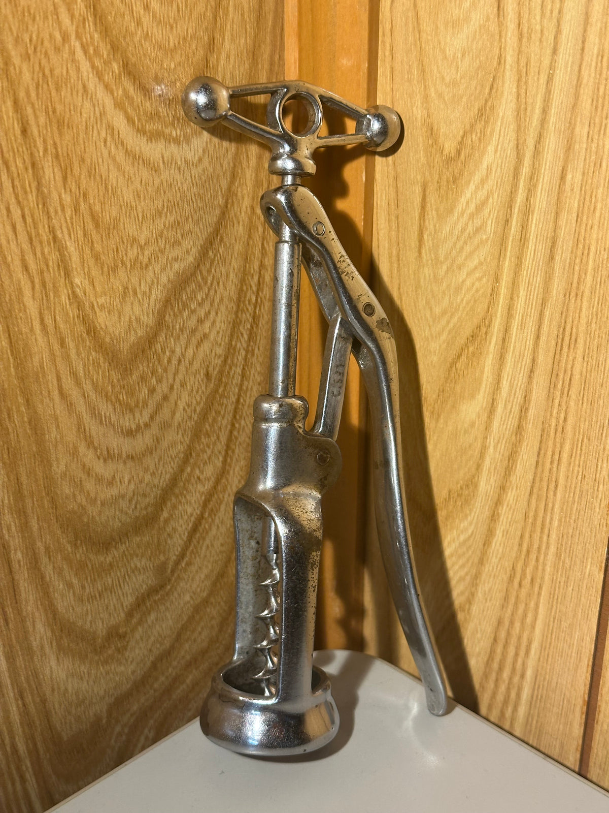 Metallic tool on a wooden surface