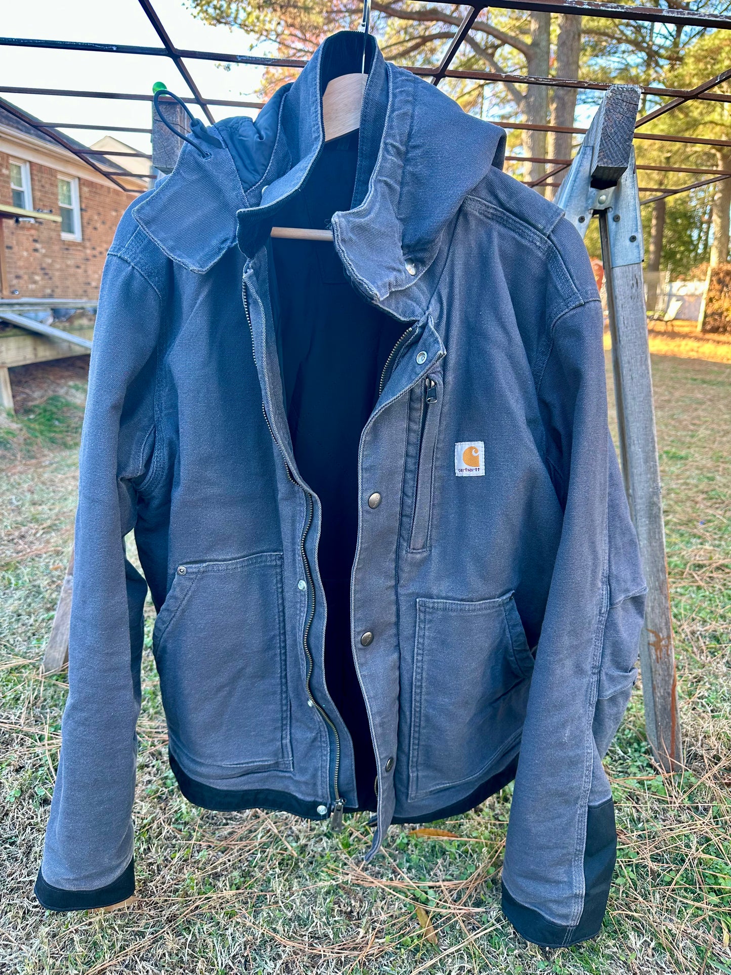 Blue jacket hanging on a clothesline outdoors