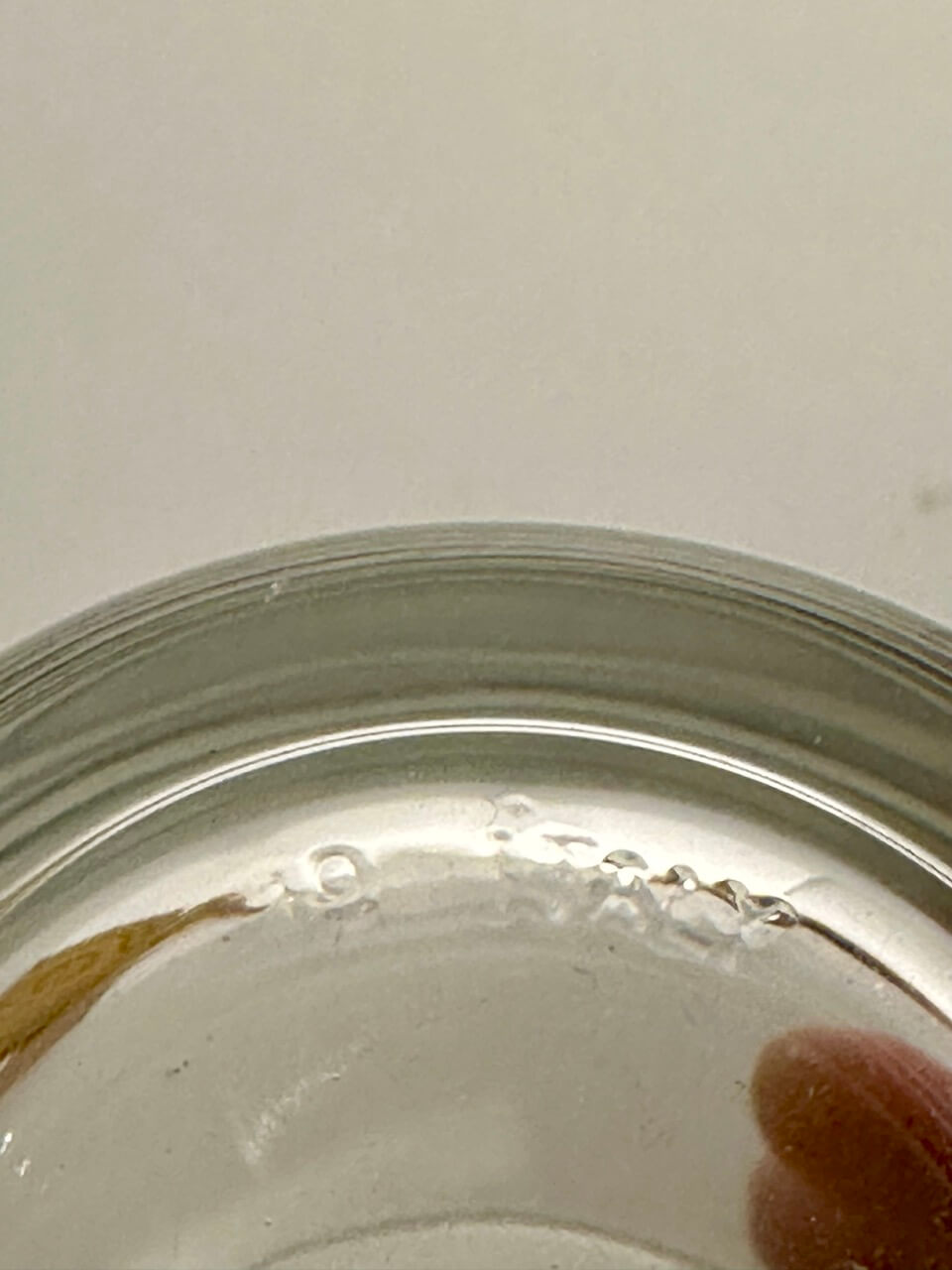 Close-up of a glass embossed with "19 ITALY"