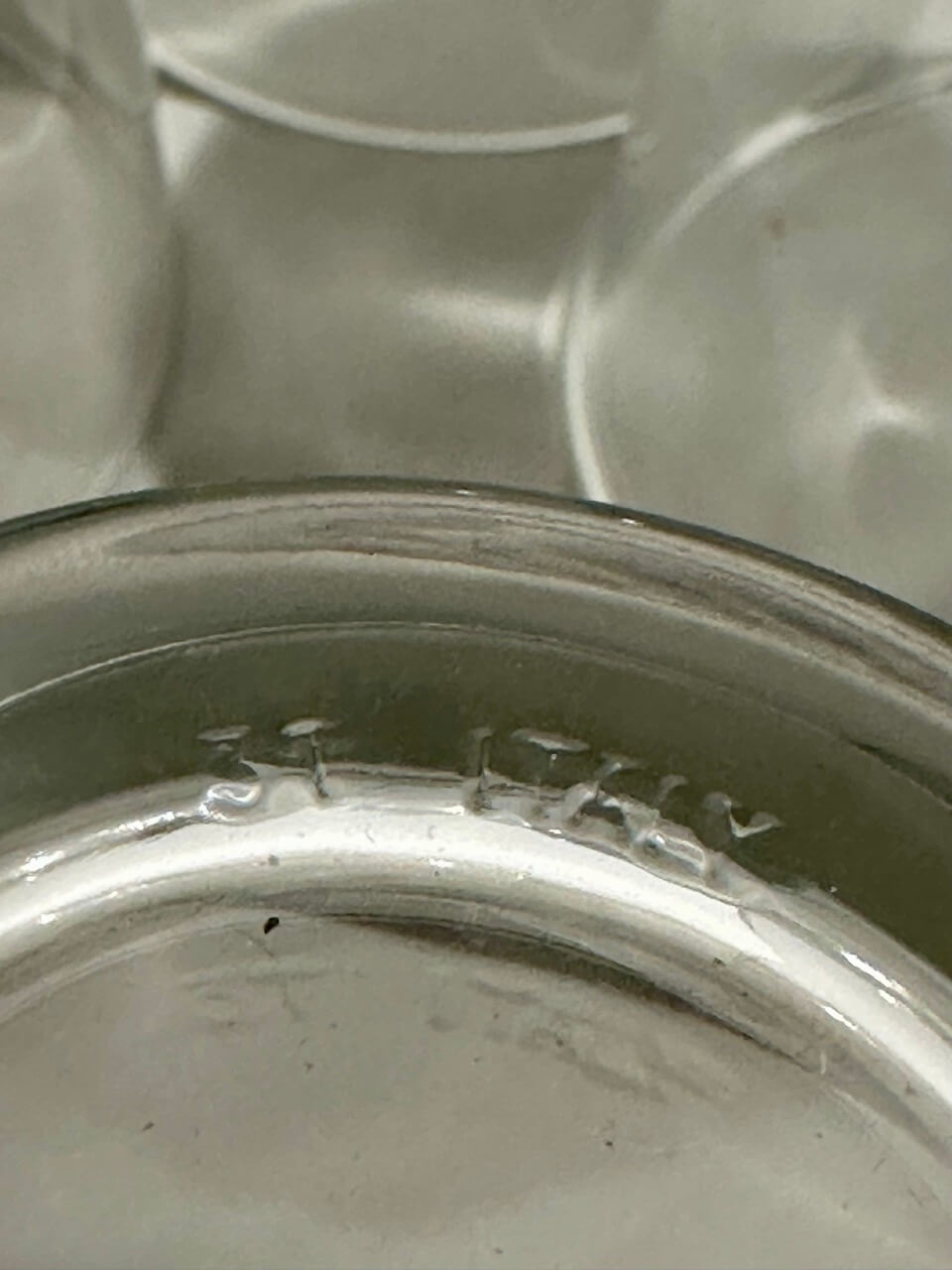 Close-up of a glass embossed with "31 ITALY"