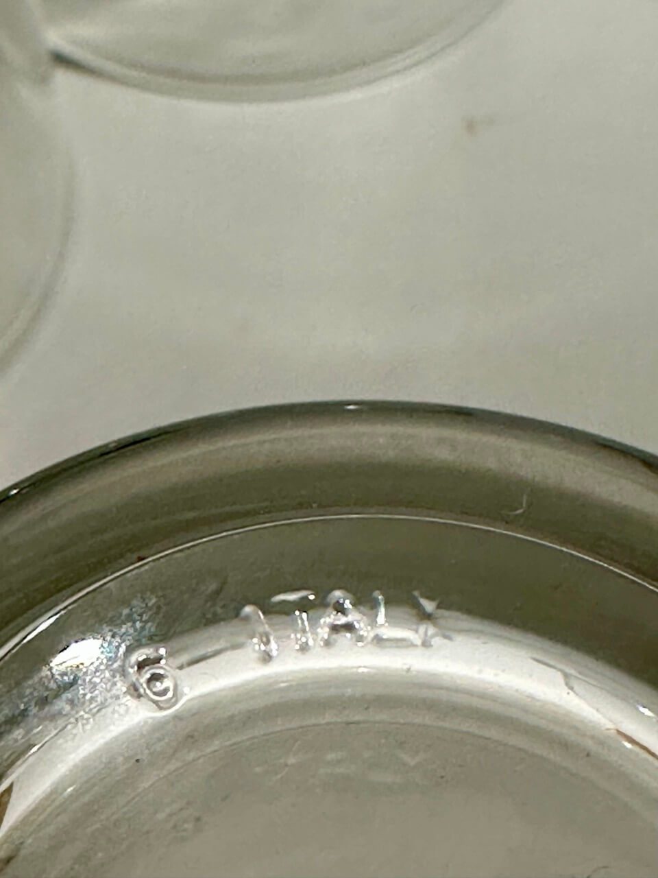Close-up of a glass embossed with "6 ITALY"