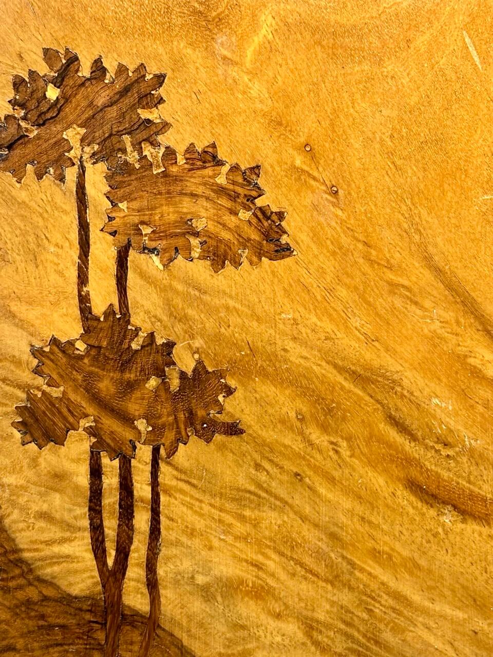 Wooden surface with intricate carvings of trees