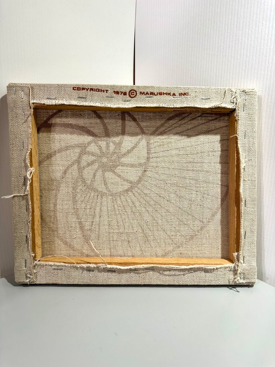Stretched canvas with the words 'copyright 1976 Marushka INC.'