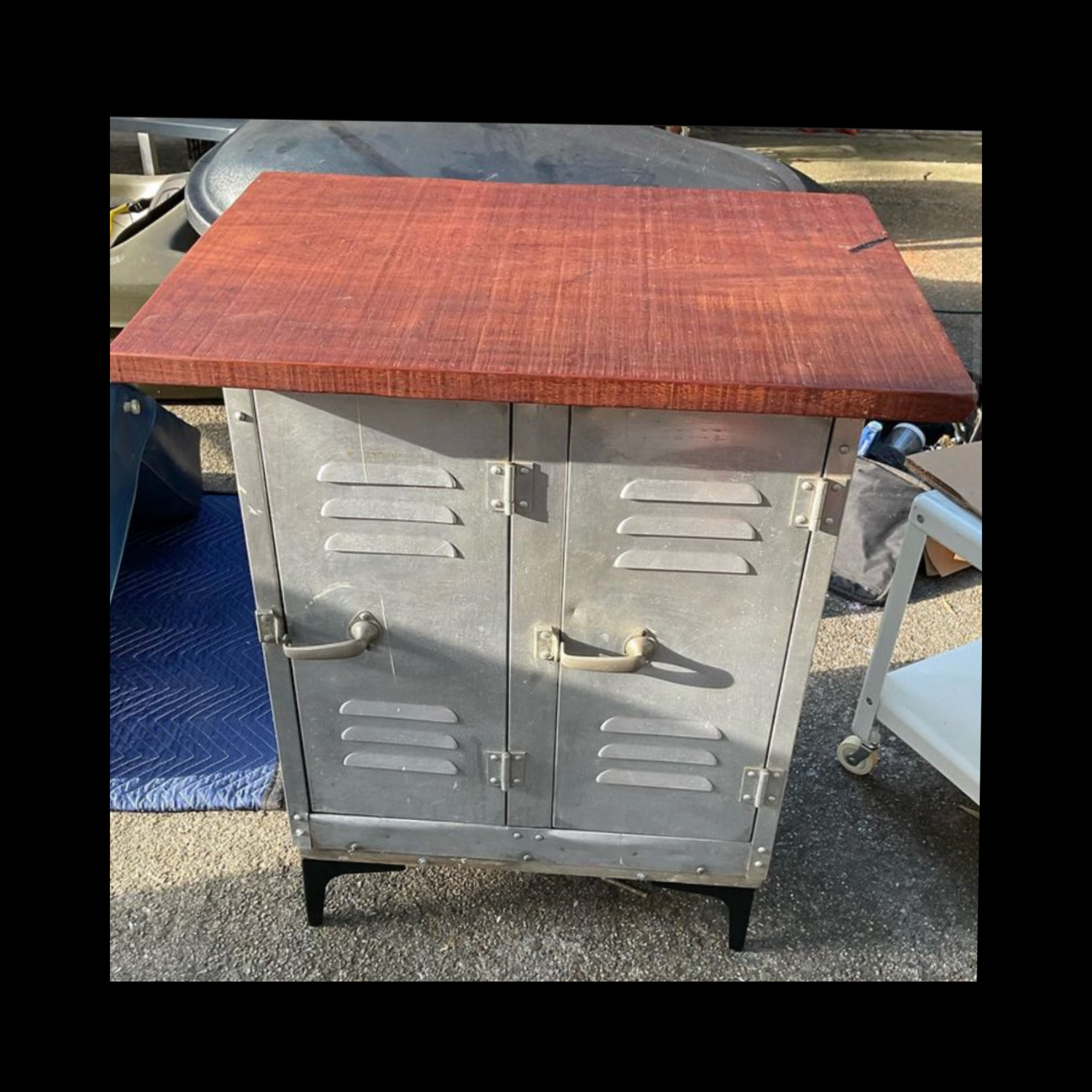 Locker stand made from a vintage aluminum double locker, set on a custom wooden base with metal feet and topped with reclaimed 70-year-old mahogany.