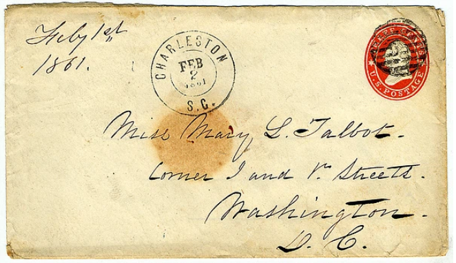 Vintage envelope with postage stamp and handwritten text, featuring a red circular stamp and black text.