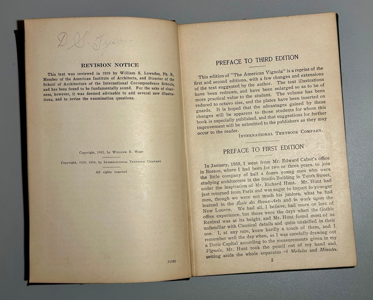 Open book with text on a gray background