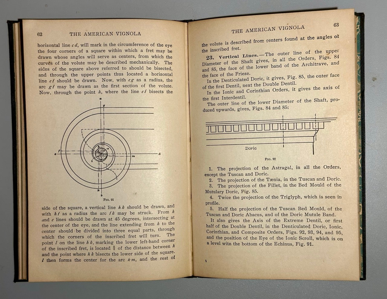 Open book with technical drawings and text on a gray background
