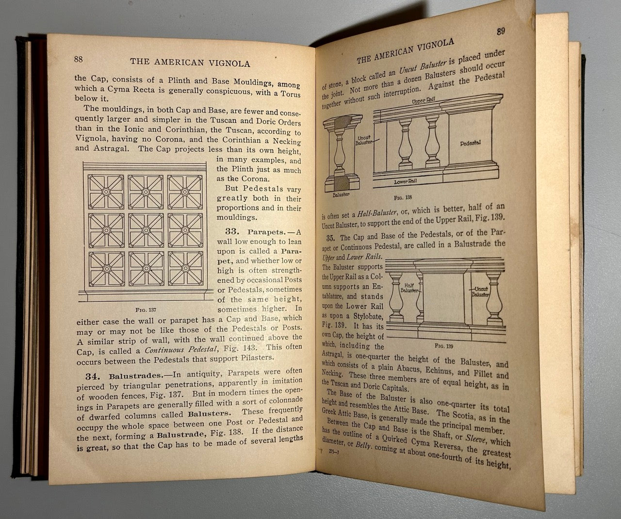 Open book with text and illustrations on a gray background
