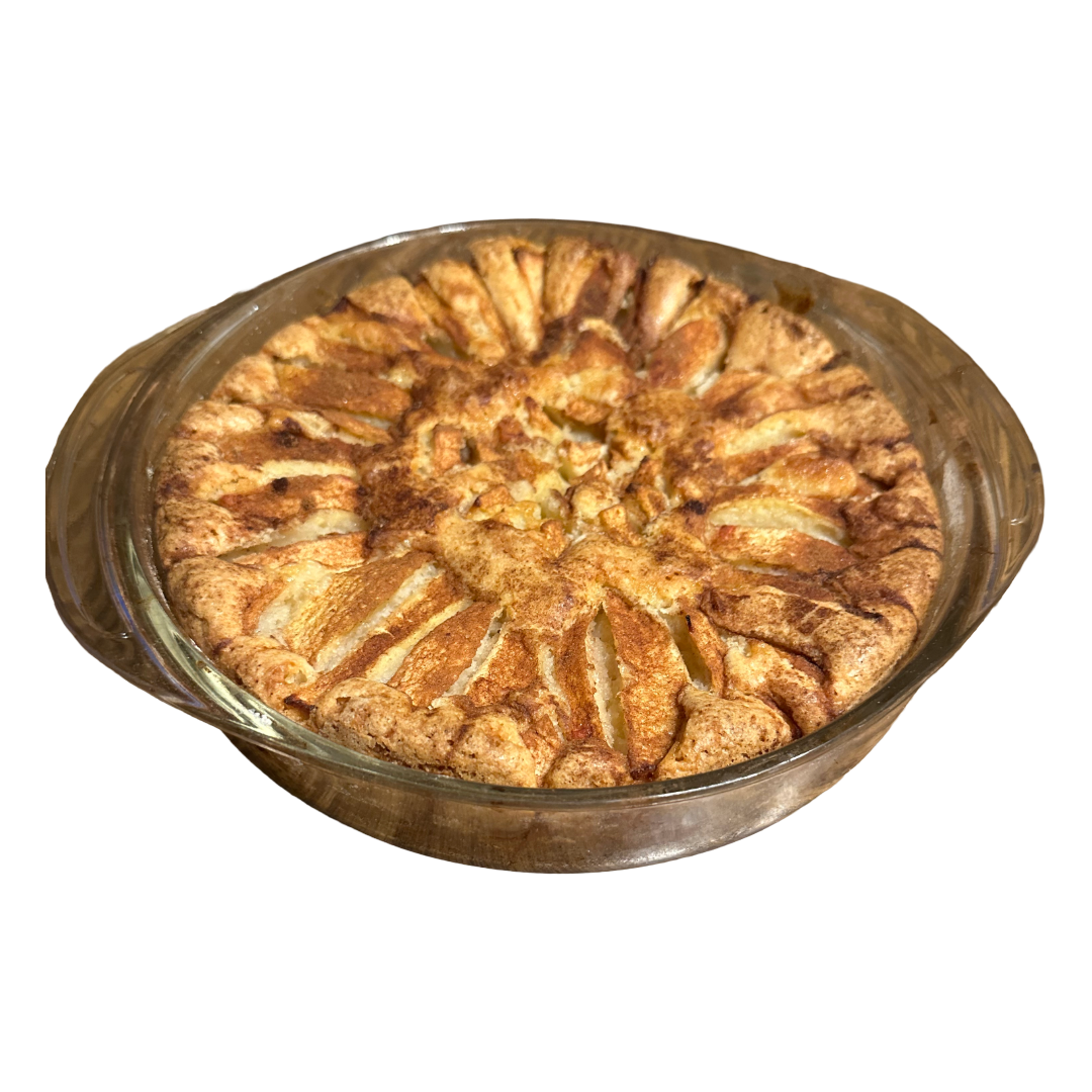 Apple cake in a glass dish on a clear 
background